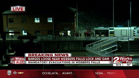 Barges loose from port, headed toward Webbers Falls Lock and Dam