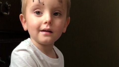 Little Boy Puts On His Mom's Makeup Before His Playdate