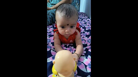 baby playing with toy