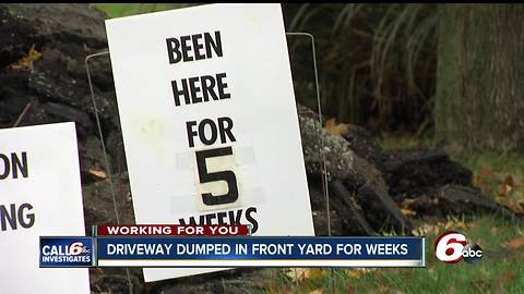 Company paves woman's driveway and old pavement sits in her yard for five weeks