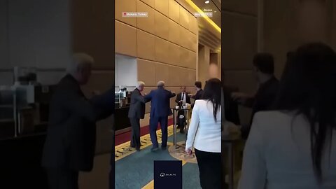 .. A Ukrainian delegate punched a Russian delegate