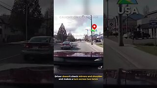 Driver doesn't check mirror and shoulder and makes a turn across two lanes!