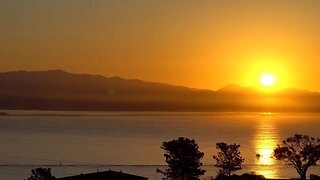 CatRise: Sunrise on Sunday Jan 22, 2023 illuminating over San Diego harbor