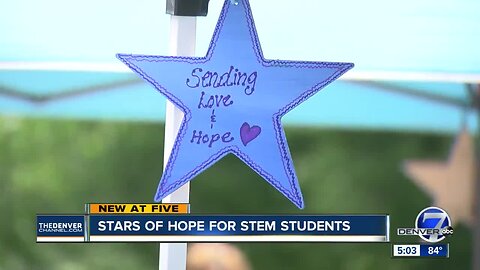 Volunteers paint stars to bring hope to STEM students after tragedy