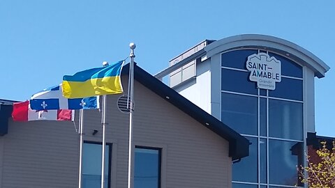 A Ukrainian flag in front of the town hall of Saint-Amable, Quebec, Canada