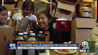 Volunteers pack up donations for volcano victims