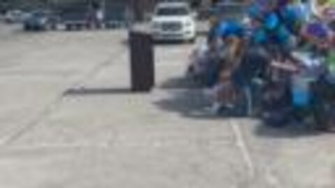 People praying over TPD patrol car at Mingo Valley Division