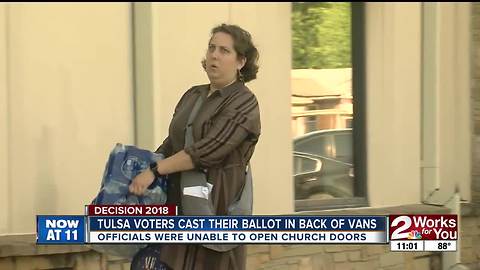 Tulsa voters cast their ballot in the back of vans