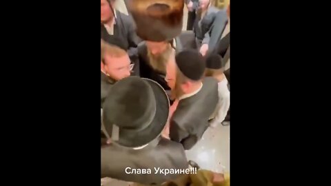 Jewish Orthodox Zionazis in Israel trampling upon a Russian flag and hailing Ukrainian mop