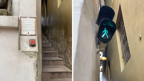 Tiny one-way stairway in Prague requires traffic light for pedestrians