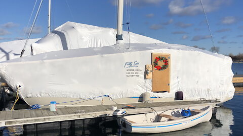 Installing the plastic dome over my sailboat home for winter