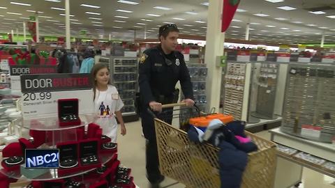 Kids shop with cop