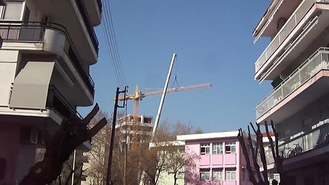 Crane dismantling without accident and compilation next to a school