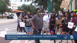 Protesters march through downtown West Palm Beach