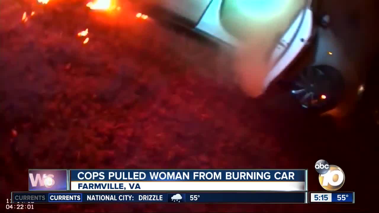 Virginia police officers pull woman from burning car