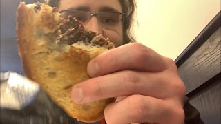 Live eating a sandwich
