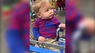 Baby is Mesmorized by Singing Christmas Decoration