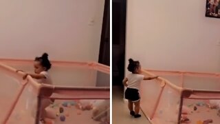 Determined baby discovers how to escape from play pen