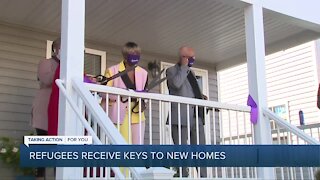 Refugees receive keys to new homes