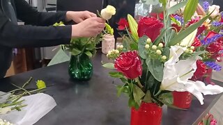 putting together a beautiful arrangement of flowers