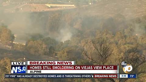 Homes still smoldering on Viejas View Place