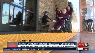 Senior community creates plexiglass for residents to visit with families