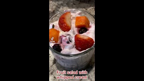 Fruit salad with whipped cream