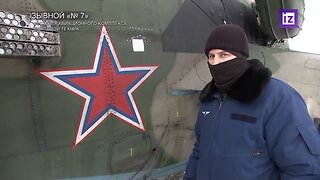 Russian soldier goes over damage on a helicopter