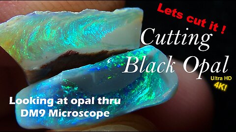 Cutting and polishing black opal rough stone to precious Gemstone Exploring opal thru microscope.