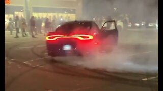 Cars performing insane donut maneuvers at car meet