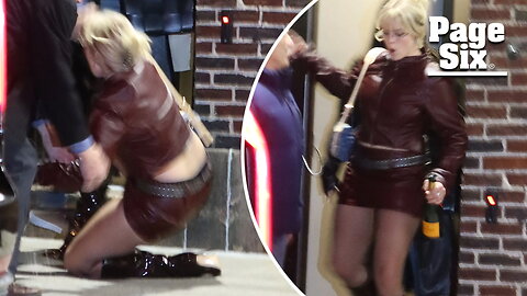 'Mean Girls' star Reneé Rapp takes a tumble in stilettos while carrying champagne bottle