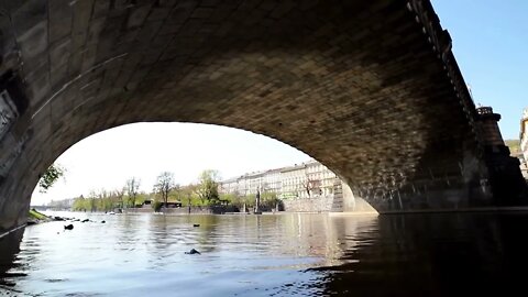 View of the river under the bridge in the Czech city