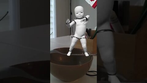 Baby Robot balancing on the spoon and dancing for you
