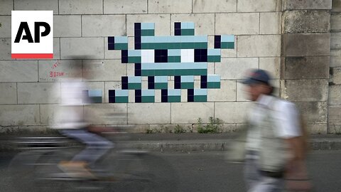 Mystery Paris street artist 'Invader' glues up new work to celebrate Olympics