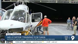 SARA rescuers in-training learn helicopter operations on their way to an orange shirt