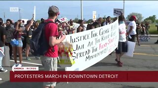 Protesters march in Downtown Detroit