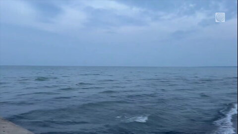 Rolling waves under some cloud cover along the shoreline of Lake Erie