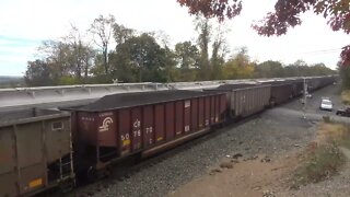 A Loaded coal train sneaks passed a train in emergency