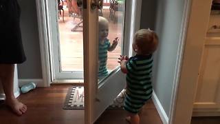 Twin Babies Pretend Patio Door Is A Mirror