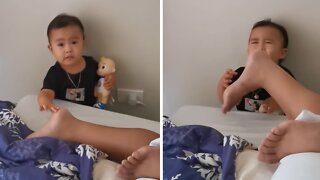 Baby tickles sleeping dad with totally shocking results