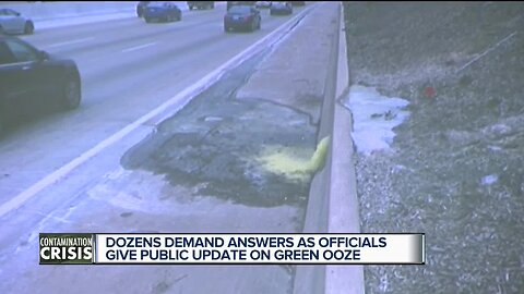 Dozens demand answers as officials give public update on green ooze