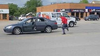 Man gets out of car and starts dancing in parking lot