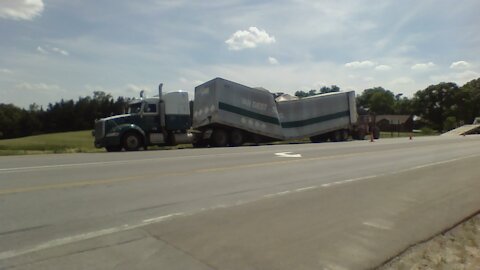 Semi splits in half .