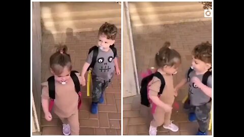 The first day of school.Gentle little boy combing little girl's hair.😍