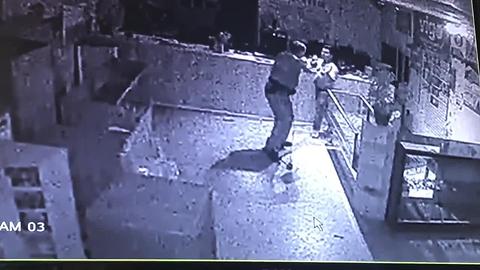 Surveillance video: Police officer fights for his life as burglar attacks