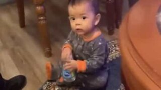 One-year-old does 4 bottle flips in a row!