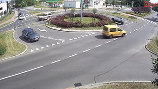 Car Spins Out On Traffic Roundabout