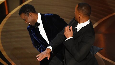 Watch the uncensored moment Will Smith smacks Chris Rock on stage at the Oscars, drops F-bomb