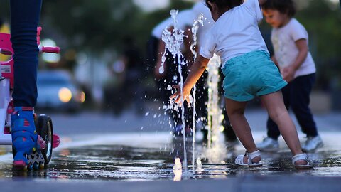 children playing happily with water.