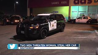 2 men threaten woman, steal her car